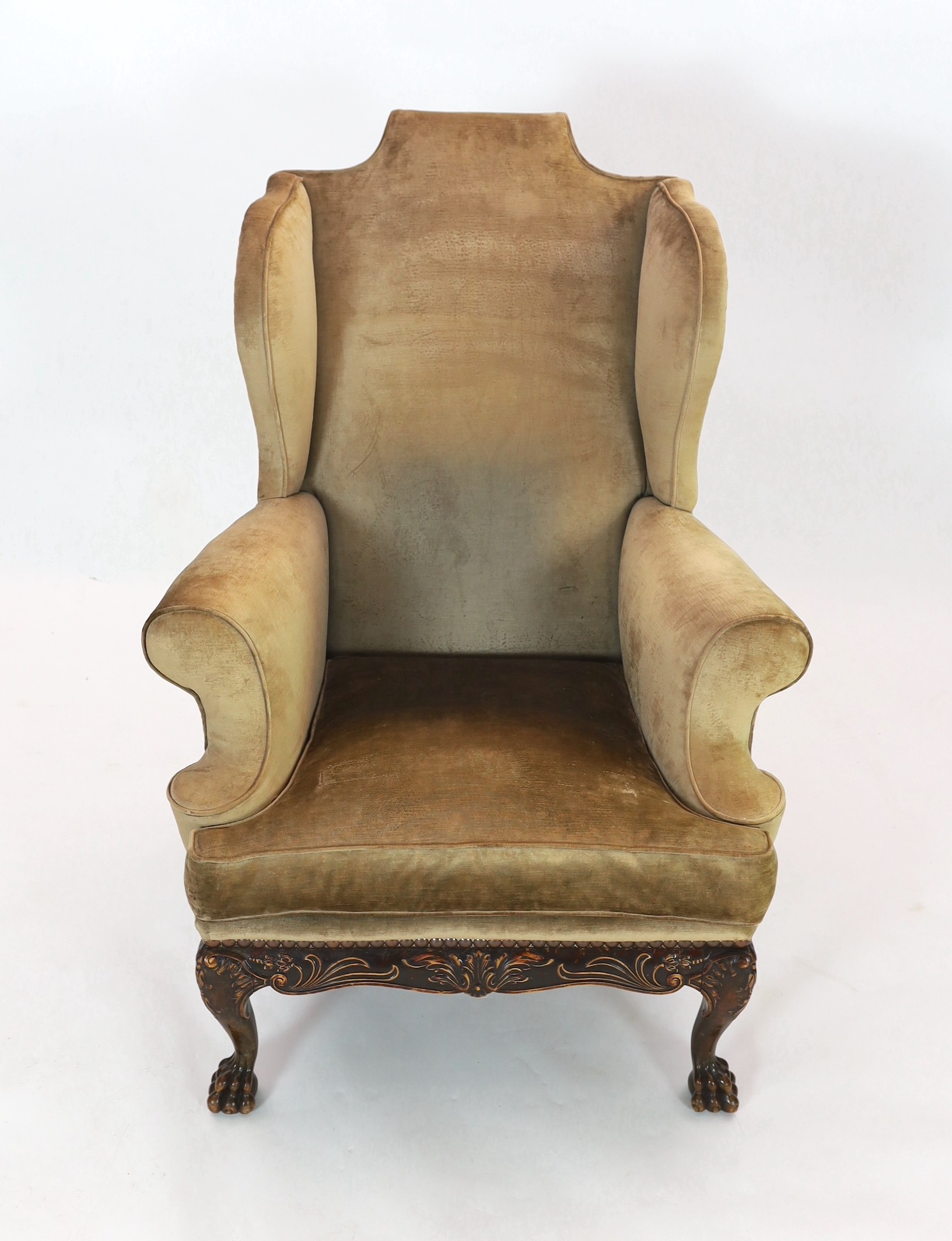 An Irish mahogany wing armchair, width 90cm, depth 98cm, height 120cm